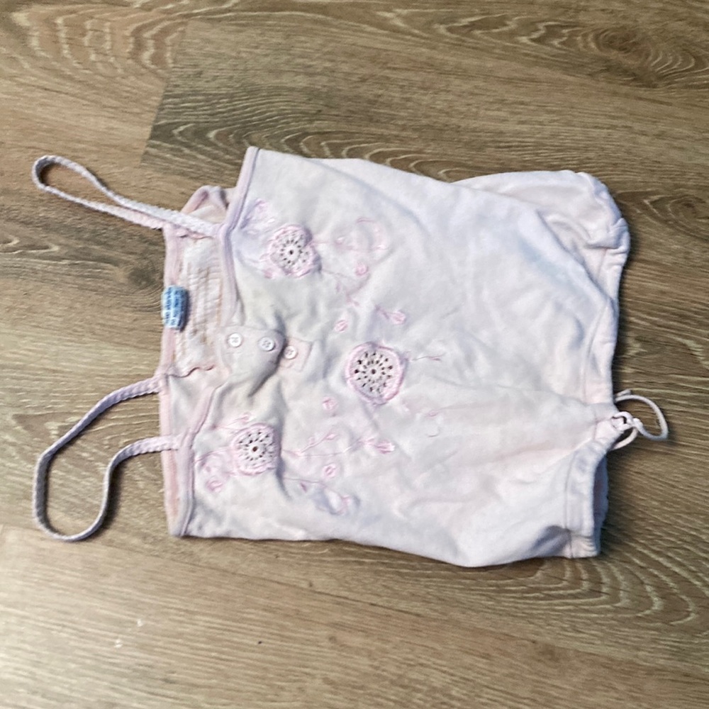 Pink shirt with embroidered flowers on front
